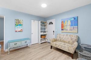 a living room with a couch and a table at Flagler Suites 4 in New Smyrna Beach