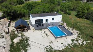 an aerial view of a house with a swimming pool at Villa Leona in Neum