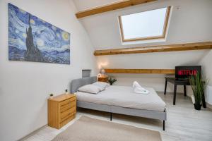 a bedroom with a bed and a desk and a window at COLIVING - Private Suite Bathroom - Toilet in Saint-Jean-de-Gonville