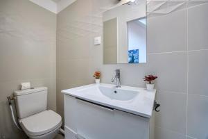 a white bathroom with a toilet and a sink at COLIVING - Private Suite Bathroom - Toilet in Saint-Jean-de-Gonville