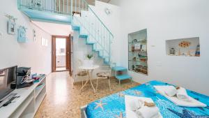 a room with a bed and a staircase at La Casa Di Nicole by Rentbeat in Polignano a Mare +41 photos