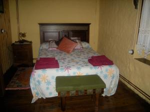 Tempat tidur dalam kamar di El Horrín De Claudia