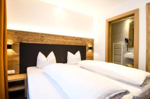 Posteľ alebo postele v izbe v ubytovaní Hotel Garni Persutt