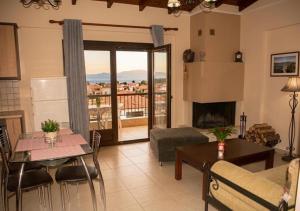 a living room with a couch and a table at Villa Maria in Ierissos