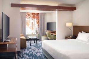 a hotel room with a bed and a television at Fairfield Inn & Suites by Marriott Cape Cod Hyannis in Hyannis