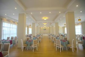 a banquet hall with tables and chairs in a room at Haile Hotel Debre Birhan in Debre Birhan
