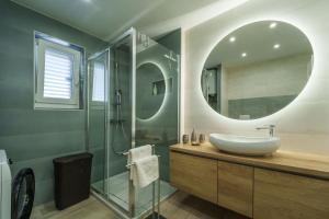 a bathroom with a sink and a mirror at Apartments Barbara Kraljevica in Kraljevica +62 photos