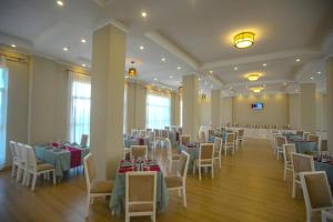 a banquet hall with tables and chairs in a room at Haile Hotel Debre Birhan in Debre Birhan