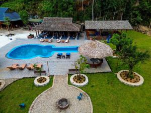 an aerial view of a resort with a swimming pool at Loop Tribe Hostel in Ha Giang +58 photos