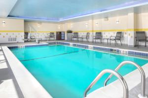 a pool with blue water in a hotel room at Fairfield Inn & Suites by Marriott Cape Cod Hyannis in Hyannis
