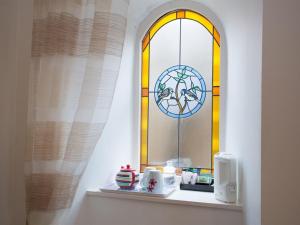 a window in a room with a shelf with a microwave at Arduthie House in Stonehaven
