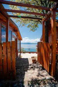 a wooden building with a view of the ocean at Paradise Nest in Ohrid