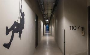 a hallway with a painting of a woman on the wall at Sugar Marina Hotel CLIFFHANGER Aonang in Ao Nang Beach