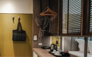 a kitchen with a counter top with auggage at Sugar Marina Hotel CLIFFHANGER Aonang in Ao Nang Beach +18 photos