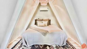 a bedroom with a bed in a tent at Serene Mountain Waterfront A-Frame Cabin in Robbinsville