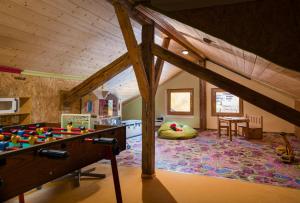 a living room with a table and a room with at Bayerische Gastwirtschaft Dimpfl-Stadl in Lam