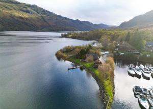 an aerial view of a lake with boats in it at Ardlui Holiday Park in Arrochar