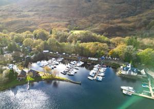 an aerial view of a marina with boats in the water at Ardlui Holiday Park in Arrochar +16 photos