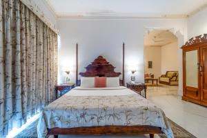 a bedroom with a large bed in a room at Fateh Garh Resort by Fateh Collection in Udaipur +95 photos