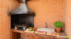 a brick oven with meat and vegetables on a counter at Villa Sitges Maria Sunny Oriented SW AC Confortable High Quality 5 star guest coments in Olivella