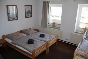 a bedroom with a bed with two bags on it at Möwennest Zempin in Zempin