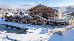 an aerial view of a lodge in the snow at Schiefergut Family Resort Flachau in Flachau