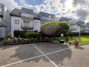 a parking lot in front of a building at Chez Swan et Yuliya in Mooslargue