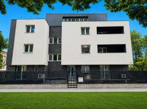 a building with a black and white at Arena Park in Bucharest
