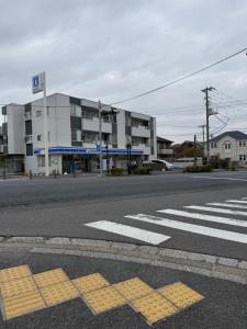 an empty street in front of a building at 蔵 The KURA in Urayasu