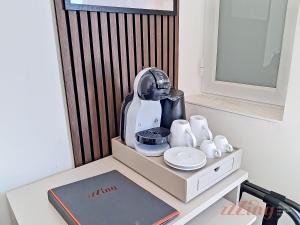 a mixer sitting on top of a table with cups at Lepanto Guesthouse in Misraħ Il-Barrieri