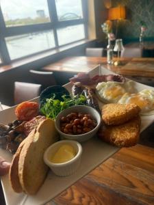 a plate of breakfast food on a table at Boars Head Boutique Hotel in Sunderland +17 photos
