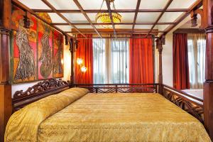 Postel nebo postele na pokoji v ubytování Akritas Ef Zin Villas & Suites