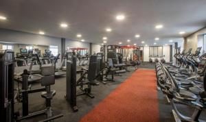 a gym with a lot of treadmills and machines at Maldron Hotel & Leisure Centre, Oranmore Galway in Oranmore
