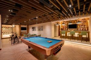 a billiard room with a pool table and a bar at Lemon Tree Premier, Biratnagar, Nepal in Biratnagar
