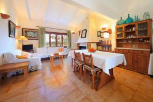 a living room with a table and a couch at Cana Joana in Santa Margalida