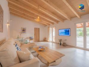 a living room with a couch and a table at Finca Mica in Llucmajor
