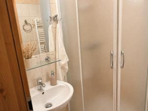 a bathroom with a shower and a sink at Penzión Liezky in Mýto pod Ďumbierom +74 photos