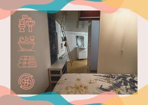 a bedroom with a bed with orange stickers on the wall at Le logement du marinier in Eckwersheim