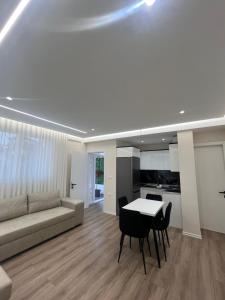 a living room with a couch and a table at Golden Stay in Pogradec