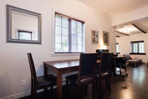 a dining room with a table and chairs at Comfort & Getaway in Old Levis - Studio Urbain in Lévis +11 photos