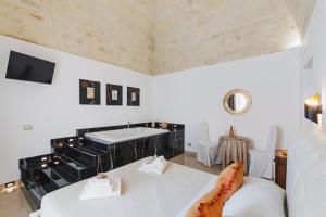 a room with two beds and a sink in it at Ventidue Venti in Bari