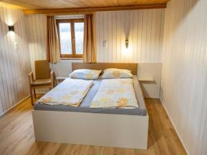 a bedroom with a large bed in a room at Ferienhof Mültner in Nordheim vor der Rhön
