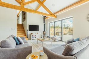 a living room with two couches and a tv at 3 Bed in Wendron oc-w29093 in Wendron