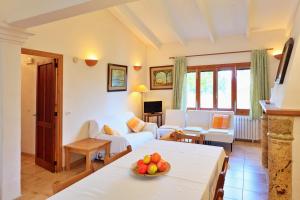 a living room with a couch and a table at Cana Joana in Santa Margalida