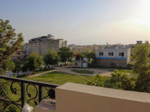 a view of a city from a balcony at Satti Palace Guest House in Rawalpindi