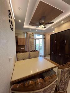 a kitchen with a table in a room at Casa Luxoria in Jalandhar +4 photos