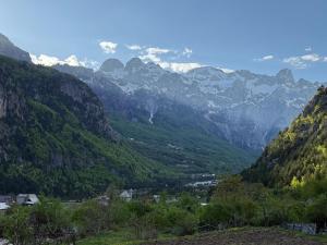 a view of a mountain valley with snow capped mountains at Oda Pisha Theth in Grumas