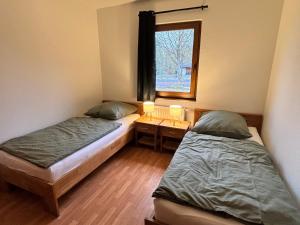 Llit o llits en una habitació de Der Highlander 9 fotos més