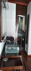 a bathroom with a sink and a mirror at Casa 51 La Plata in La Plata