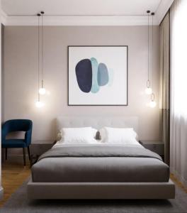 a bedroom with a bed and a blue chair at Aureline Hill in Baku